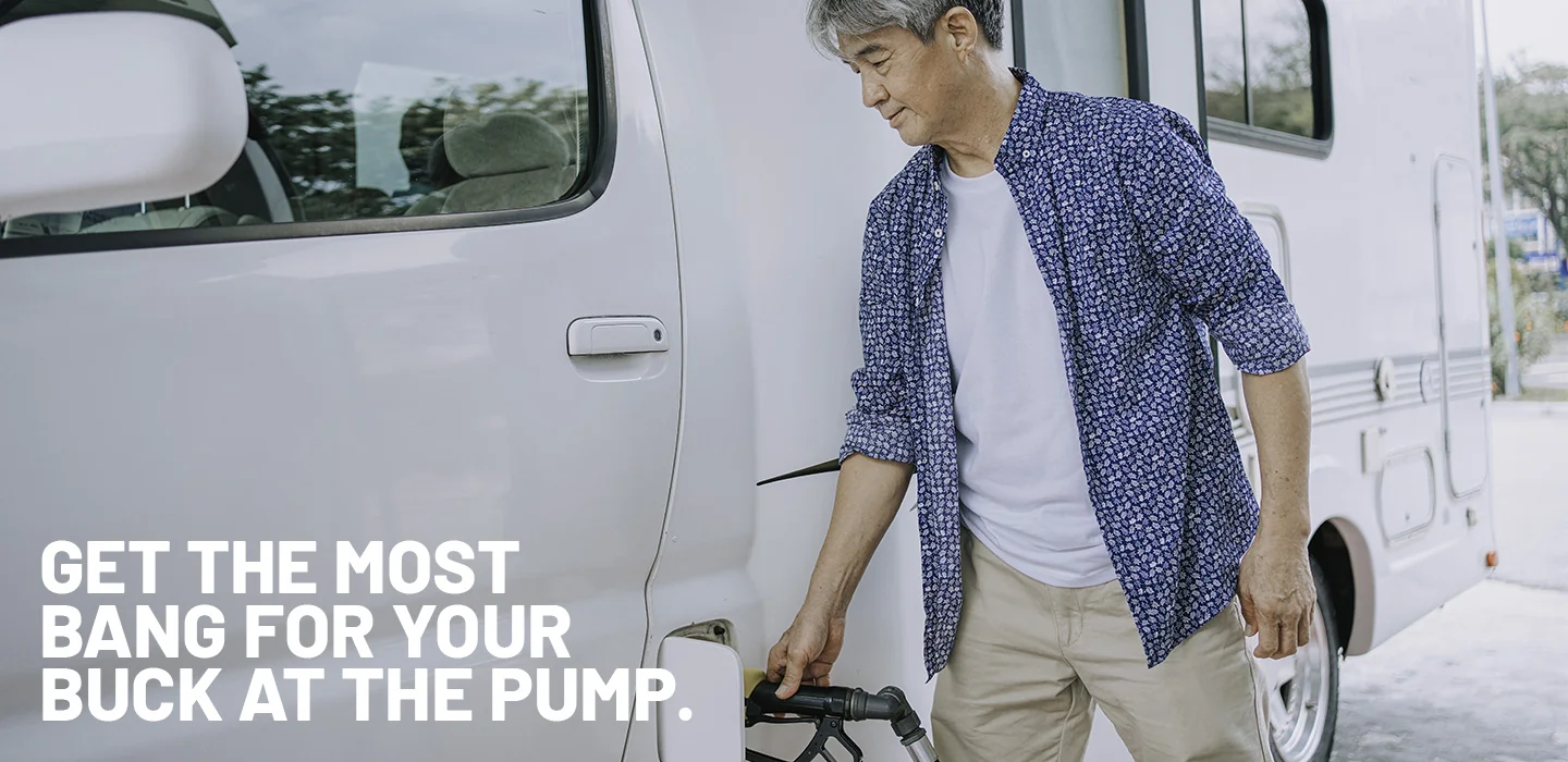 Man fueling his RV at a gas station
