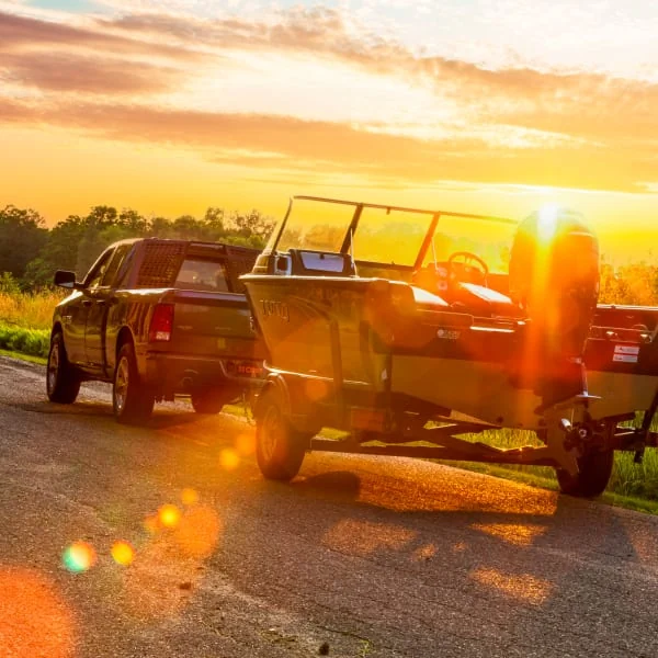 Pickup Truck Towing Boat on Trailer Pickup Truck Towing Boat on Trailer
