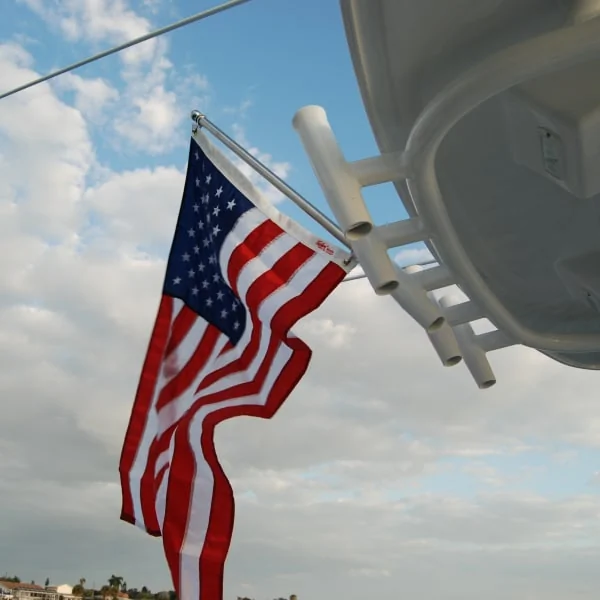 Taylor Made American Flag Hanging from Rod Holders of a T-top Boat Taylor Made American Flag Hanging from Rod Holders of a T-top Boat