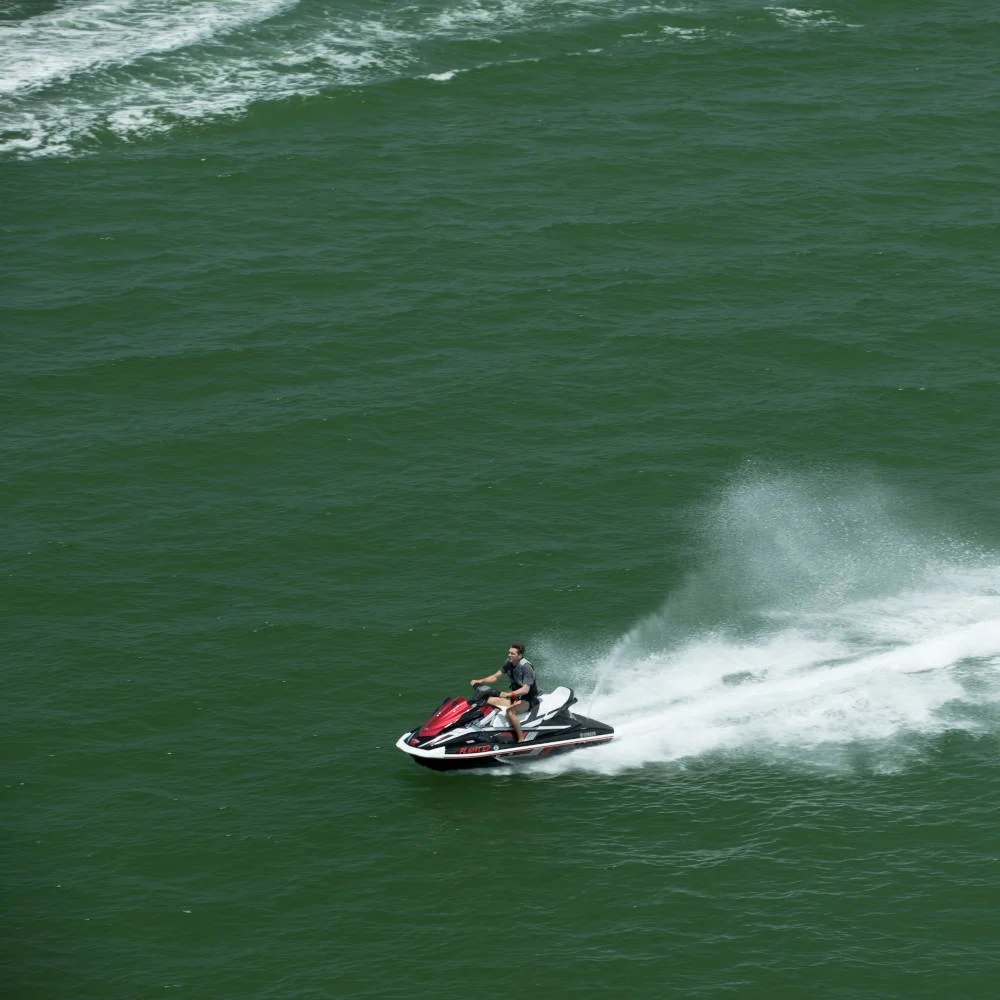 Jet ski riding across the water