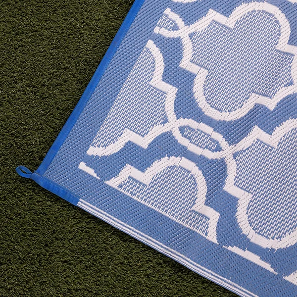 RV patio mats work for all occasions as a child plays with bubbles in front of a table