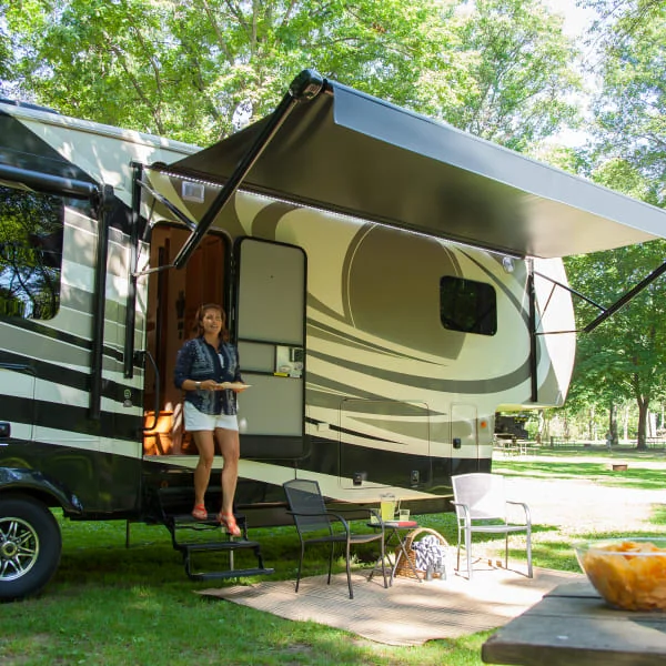 RV awning providing shade at a campsite 