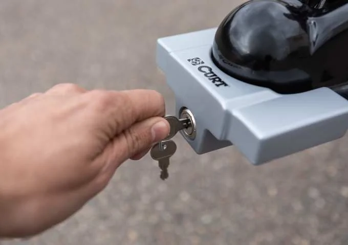 Trailer coupler lock key open