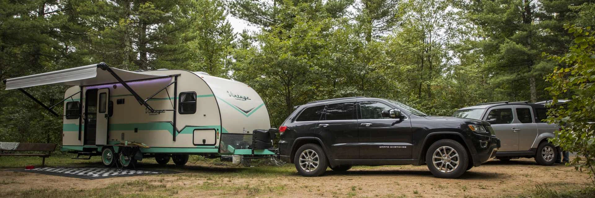 Travel Trailer and Jeep Campsite Setup