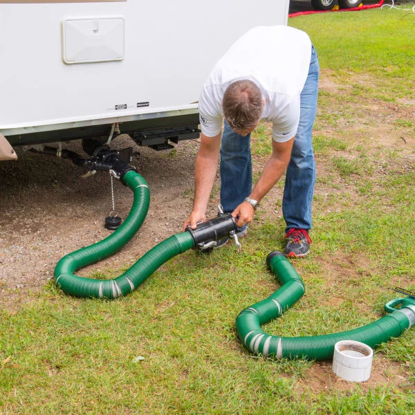 Person assembling a Waste Master RV sewer hose