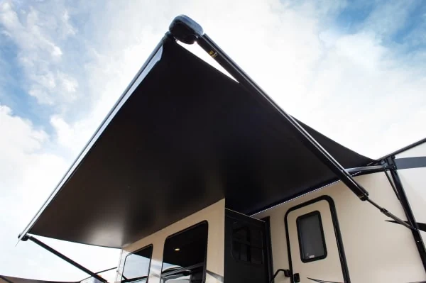 RV awning fabrics customize an outdoor living space and upgrade RV replacement awnings