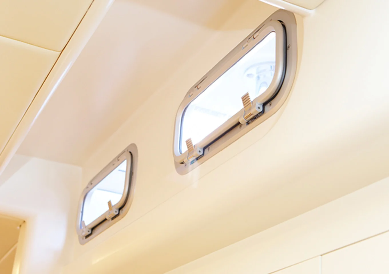 Two Portlights Looking Out from Inside of Boat