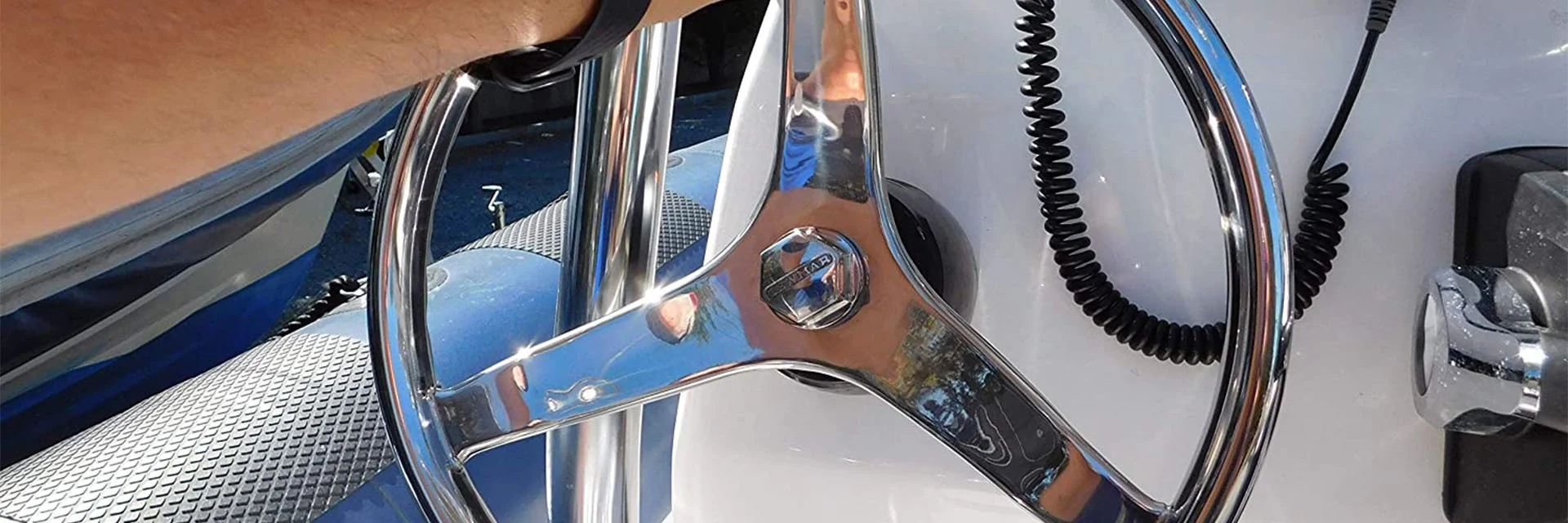 Boat Steering Wheel with Man's Hand Driving Boat Boat Steering Wheel with Man's Hand Driving Boat