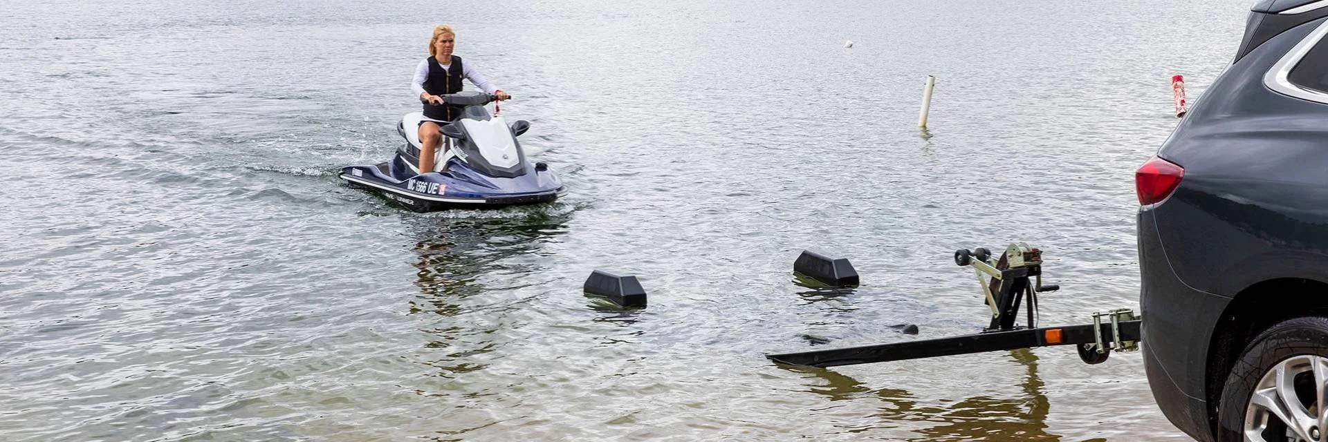 Jet Ski Being Driven onto a Boat Trailer Using Boat Trailer Guides Jet Ski Being Driven onto a Boat Trailer Using Boat Trailer Guides