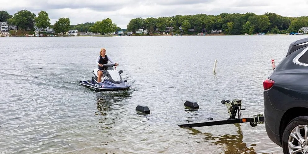 Jet Ski Being Driven onto a Boat Trailer Using Boat Trailer Guides Jet Ski Being Driven onto a Boat Trailer Using Boat Trailer Guides