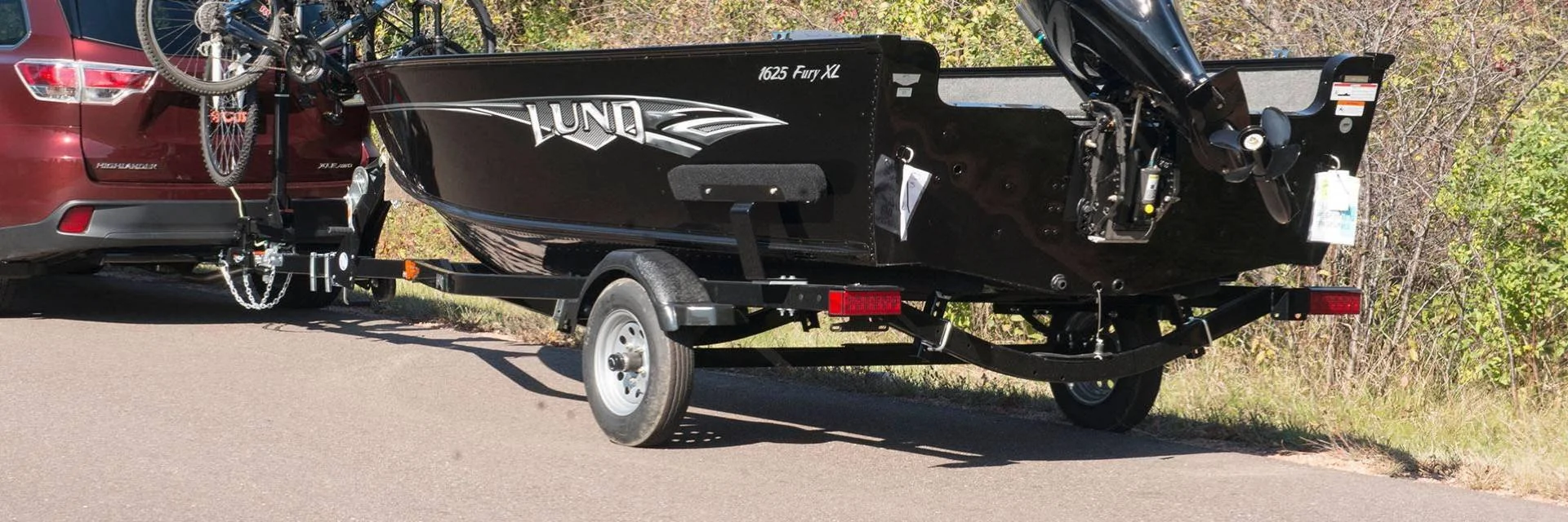 Car Pulling Boat on Trailer with Boat Trailer Lights Car Pulling Boat on Trailer with Boat Trailer Lights