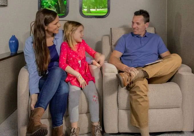 Family enjoying RV wall-hugger recliners