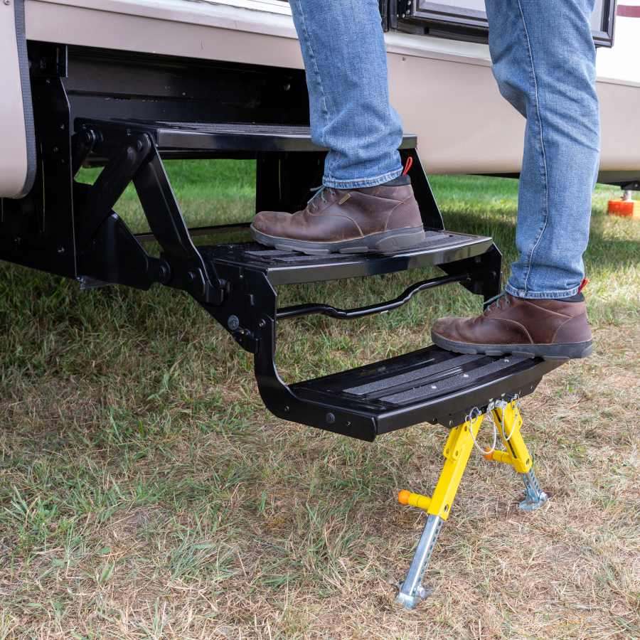 Man walking up the Lippert Solid Step with the Solid Stance step stabilizer