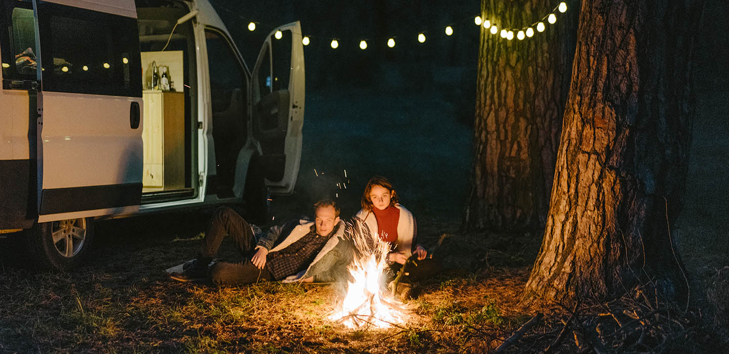 RVers sitting around a campfire RVers sitting around a campfire