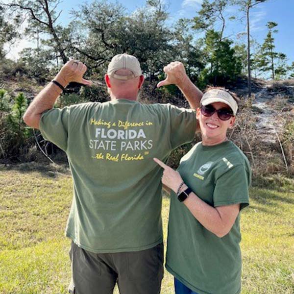 Chasing the Cashes wearing volunteer shirts