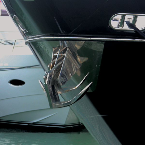 Claw boat anchor winched to boat - guide to boat anchor types