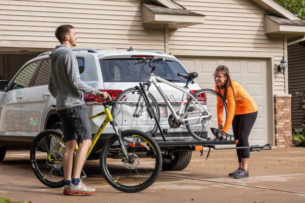 Cyclists Loading Bikes onto Bike Rack