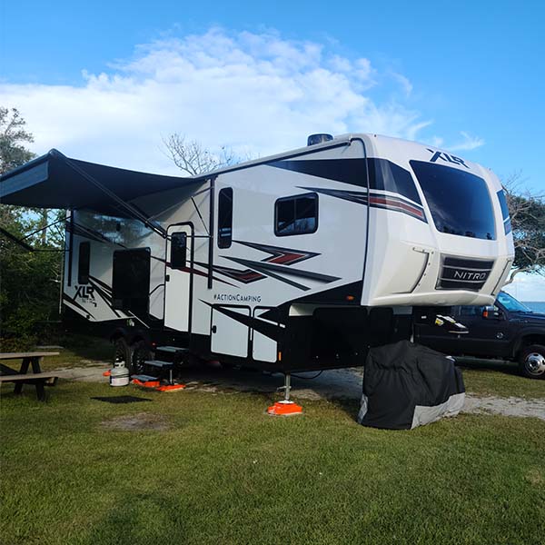 Donna’s 5th wheel parked at a Cape Lookout National Seashore campsite
