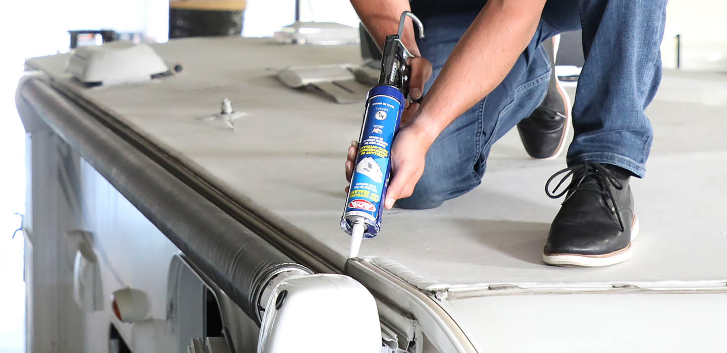 Person working on RV maintenance Person working on RV maintenance