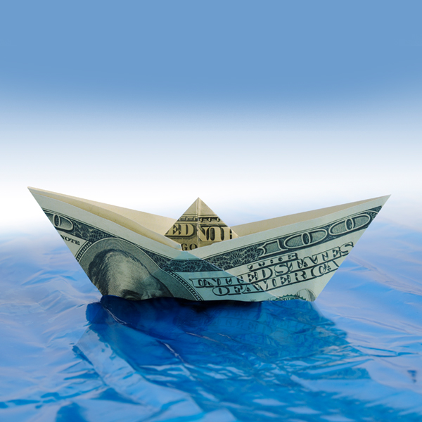 100 Dollar Money Boat Floating on Water