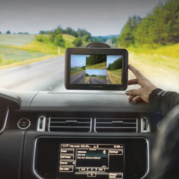 Person using a Furrion Vision S RV backup camera
