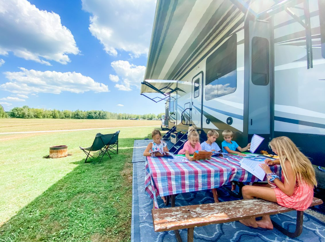 RV family homeschooling on patio