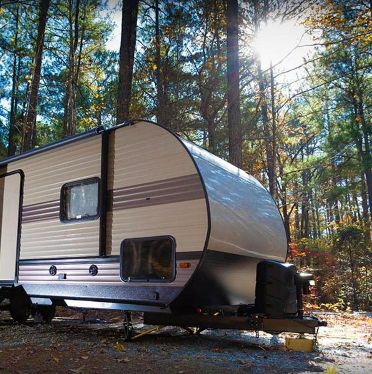 RV Travel Trailer Camped out in Woods