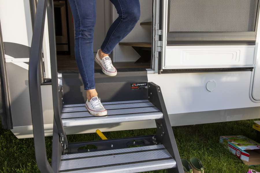 Woman walking down a set of RV steps