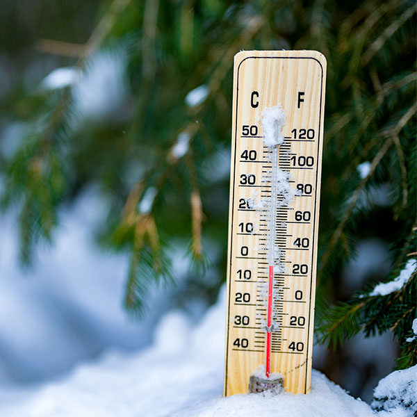 Outdoor thermometer in snow and freezing conditions