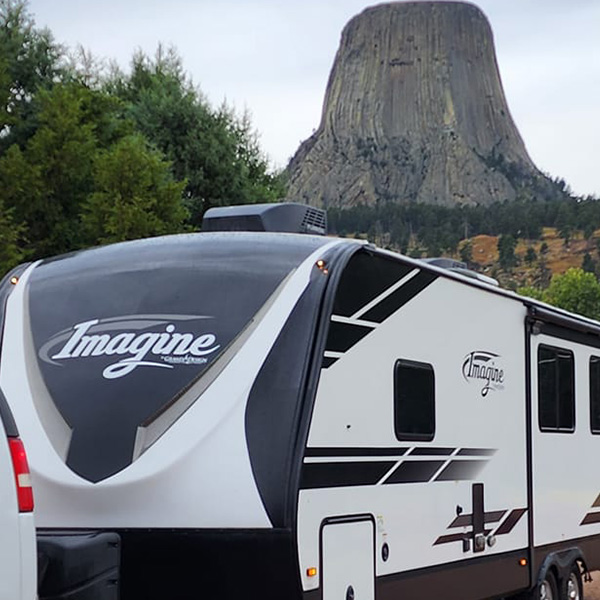 Travel trailer parked in front of Devil’s Tower