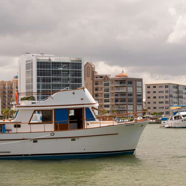 Trawler in a bay surrounded by buildings