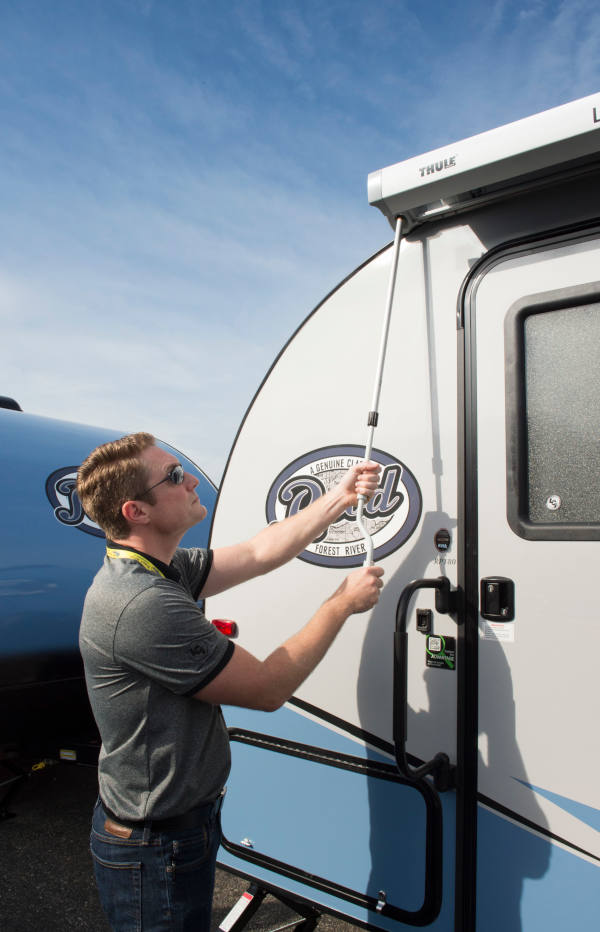 Unrolling RV Awning to Inspect