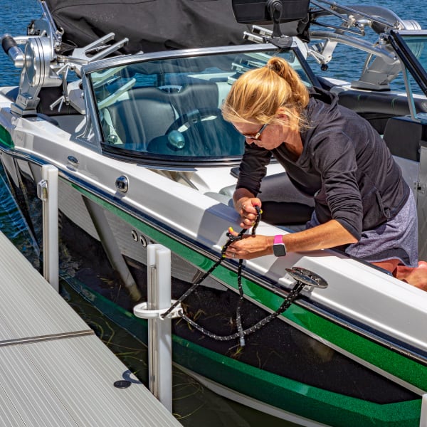 Boater using ZipDock mooring system to moor her boat