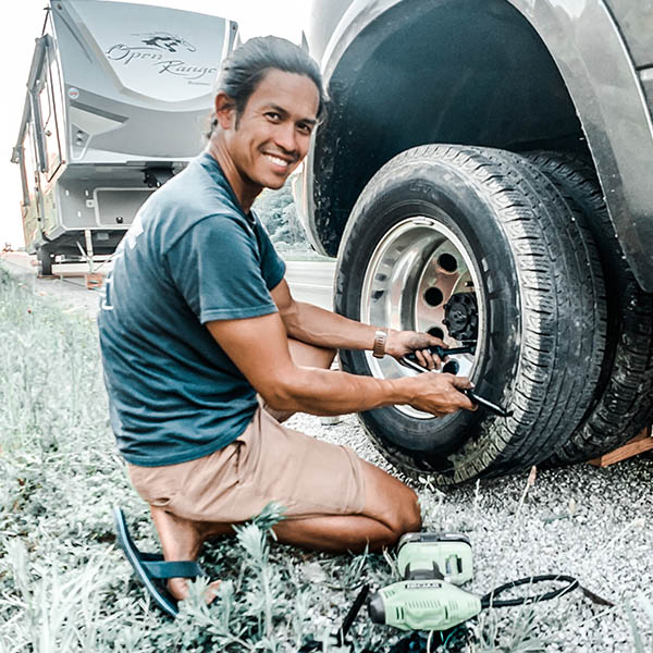 Nate ProjectTrek checking the tires on his RV tow vehicle