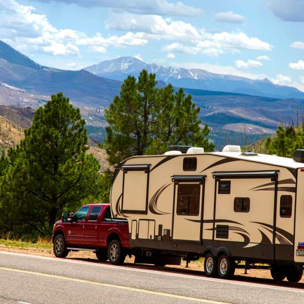 Pickup truck pulling a fifth wheel RV trailer