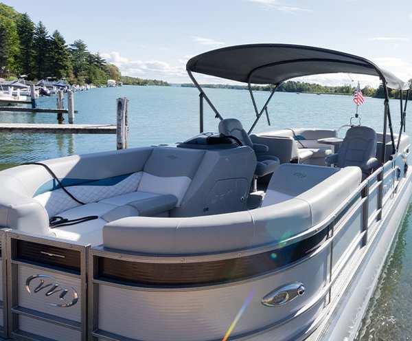 Pontoon boat closeup with seating and bimini