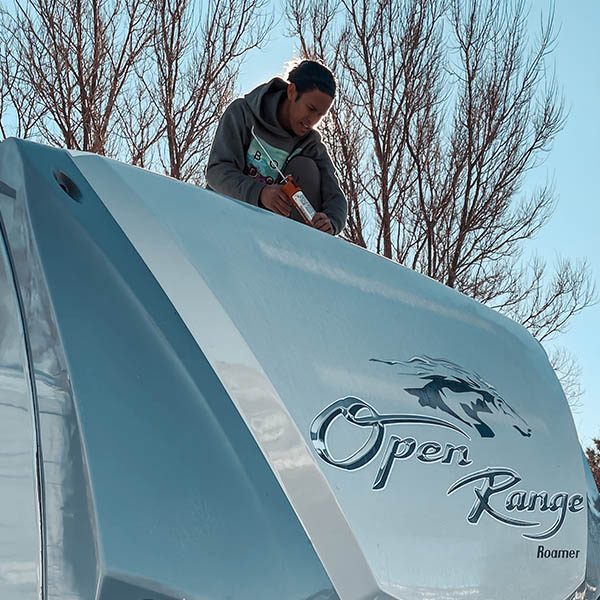 Nate from ProjectTrek sealing his RV roof